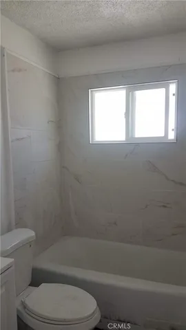 a balcony with a glass door