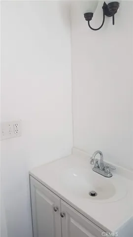 a kitchen with stainless steel appliances kitchen island granite countertop a sink window and cabinets