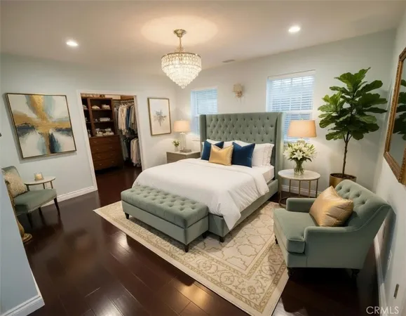 a bedroom with a bed mirror and window