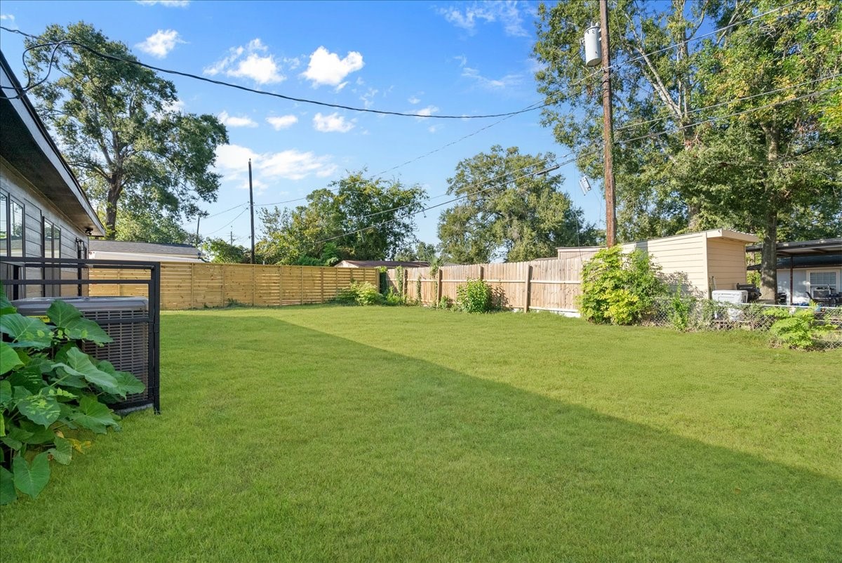 5219 Cosby Street Houston, TX 77021 - Photo 49 of 50 An expansive, fenced-in canvas of lush turf. Whether you envision a summer kitchen, a modern fire pit, or a private garden, this backyard is ready for your vision.