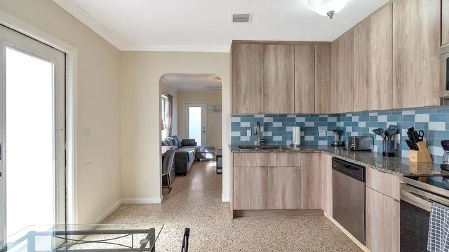 a kitchen with a sink and cabinets