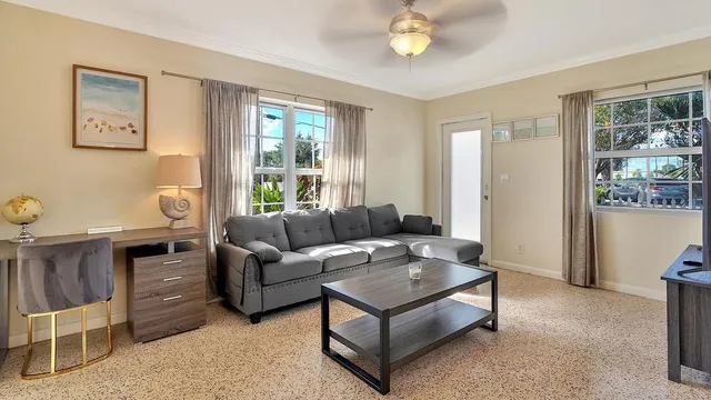 a living room with furniture and a window
