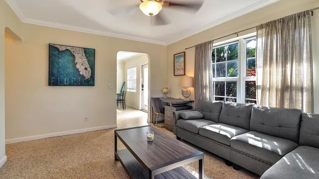 a living room with furniture and a window