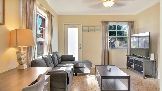 a living room with furniture and a flat screen tv