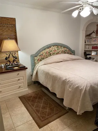a bedroom with a bed and a mirror
