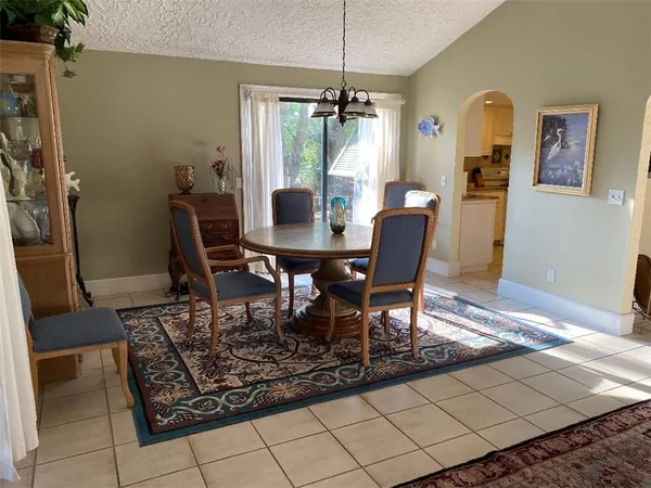 a dining room with furniture and window