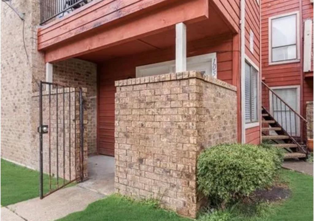 9839 Walnut Street, Unit 201 Dallas, TX 75243 - Photo 1 of 11 front view of a brick house with a small yard