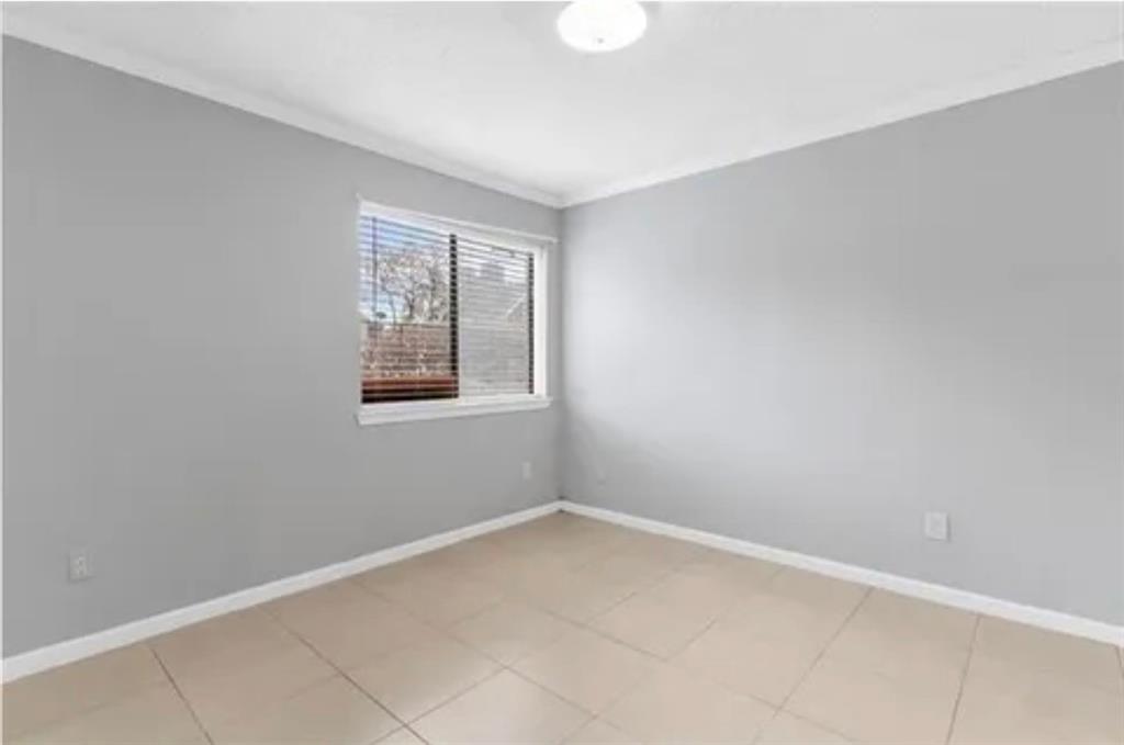 9839 Walnut Street, Unit 201 Dallas, TX 75243 - Photo 5 of 11 an empty room with windows