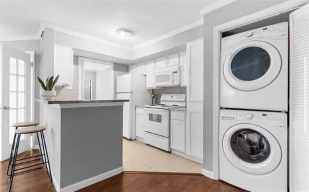 9839 Walnut Street, Unit 201 Dallas, TX 75243 - Photo 8 of 11 a view of a kitchen with washer and dryer