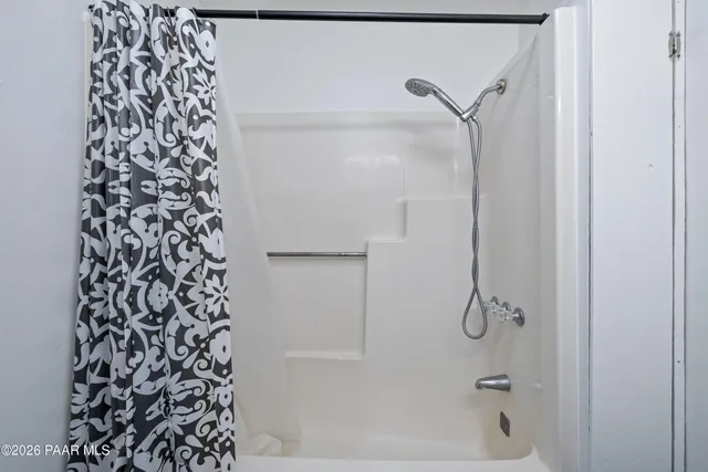 a bathroom with a shower curtain