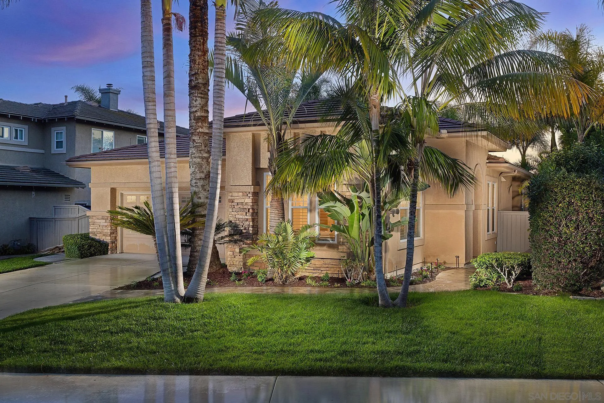 6109 Paseo Tesoro Carlsbad, CA 92009 - Photo 1 of 34 a view of a backyard with a plants and palm trees