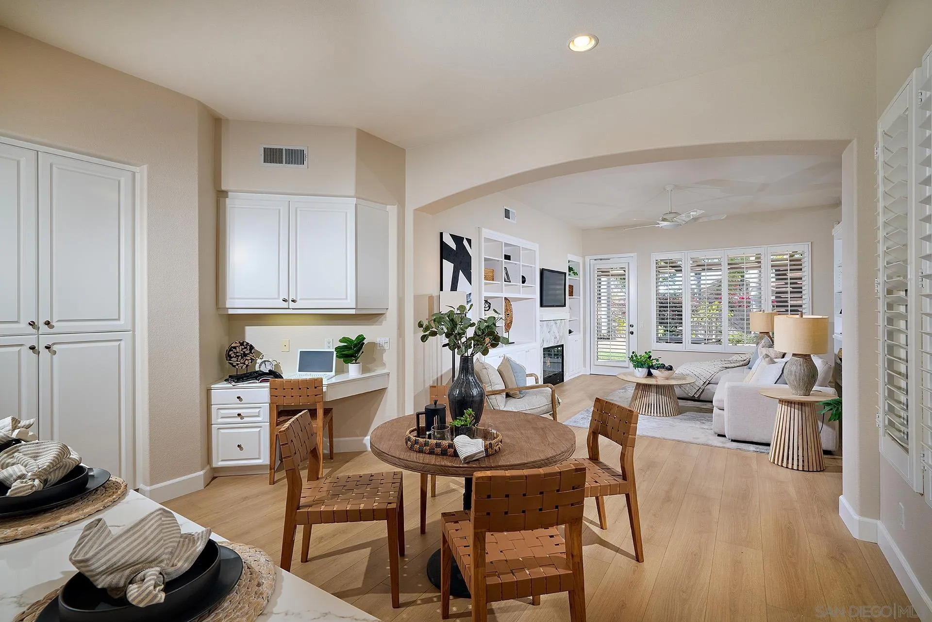 6109 Paseo Tesoro Carlsbad, CA 92009 - Photo 11 of 34 a view of a dining room with furniture window and wooden floor