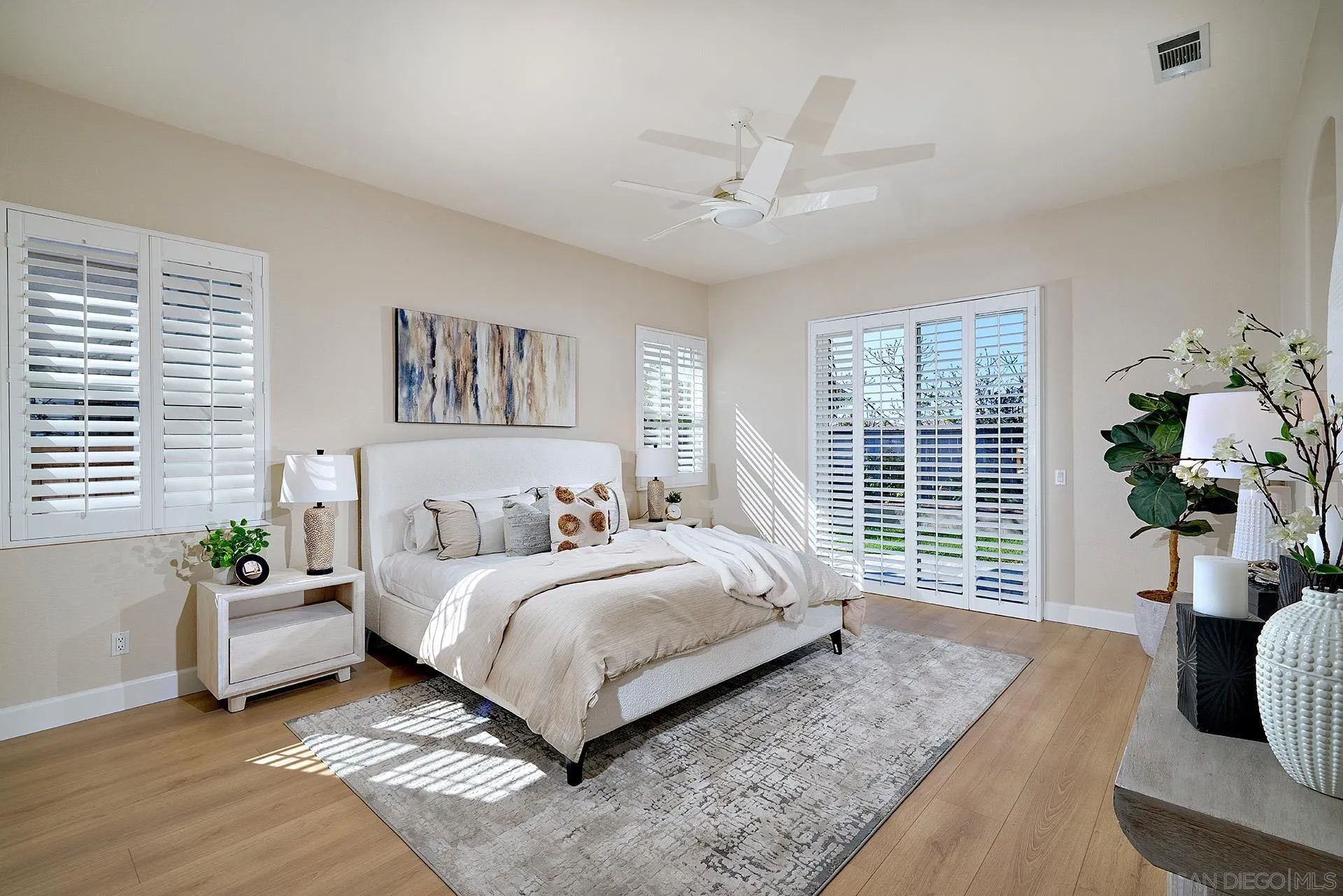 6109 Paseo Tesoro Carlsbad, CA 92009 - Photo 14 of 34 a living room with a bed furniture and a large window