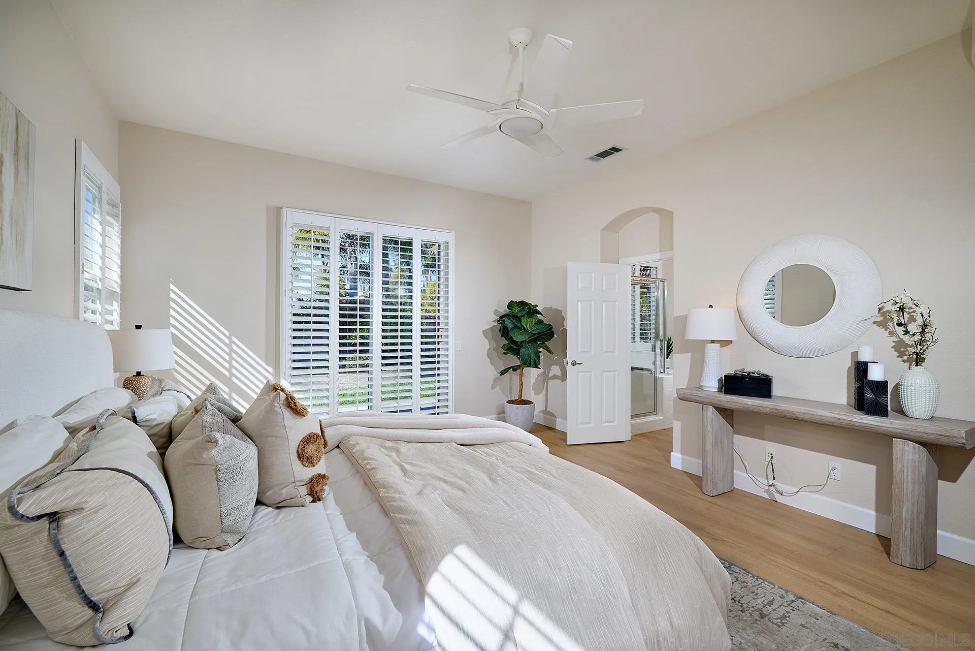 6109 Paseo Tesoro Carlsbad, CA 92009 - Photo 15 of 34 a bedroom with a large bed and a large window