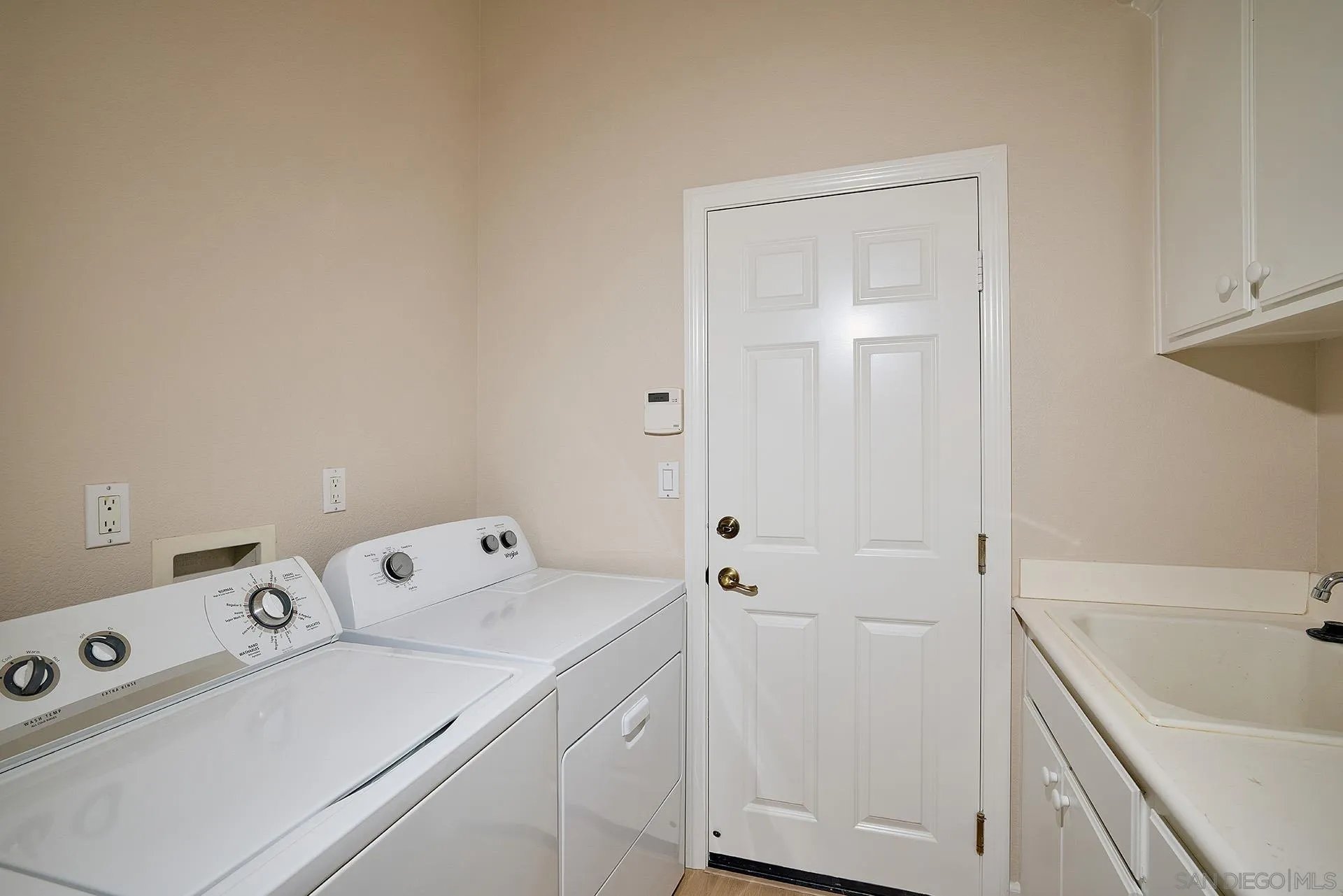 6109 Paseo Tesoro Carlsbad, CA 92009 - Photo 20 of 34 a view of utility room with washer and dryer