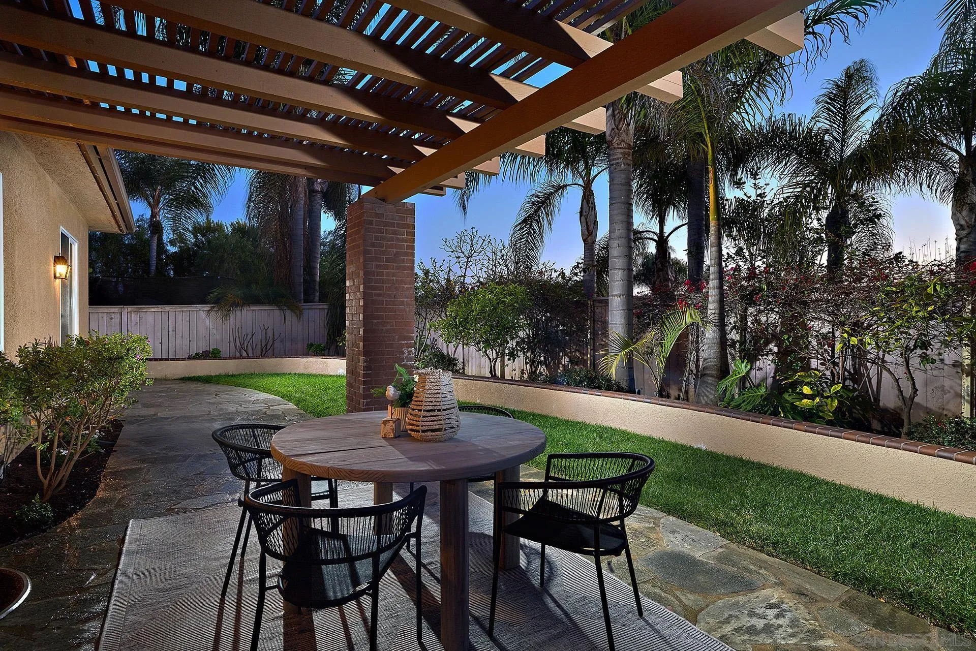 6109 Paseo Tesoro Carlsbad, CA 92009 - Photo 22 of 34 a view of an outdoor dining space with a table and chairs
