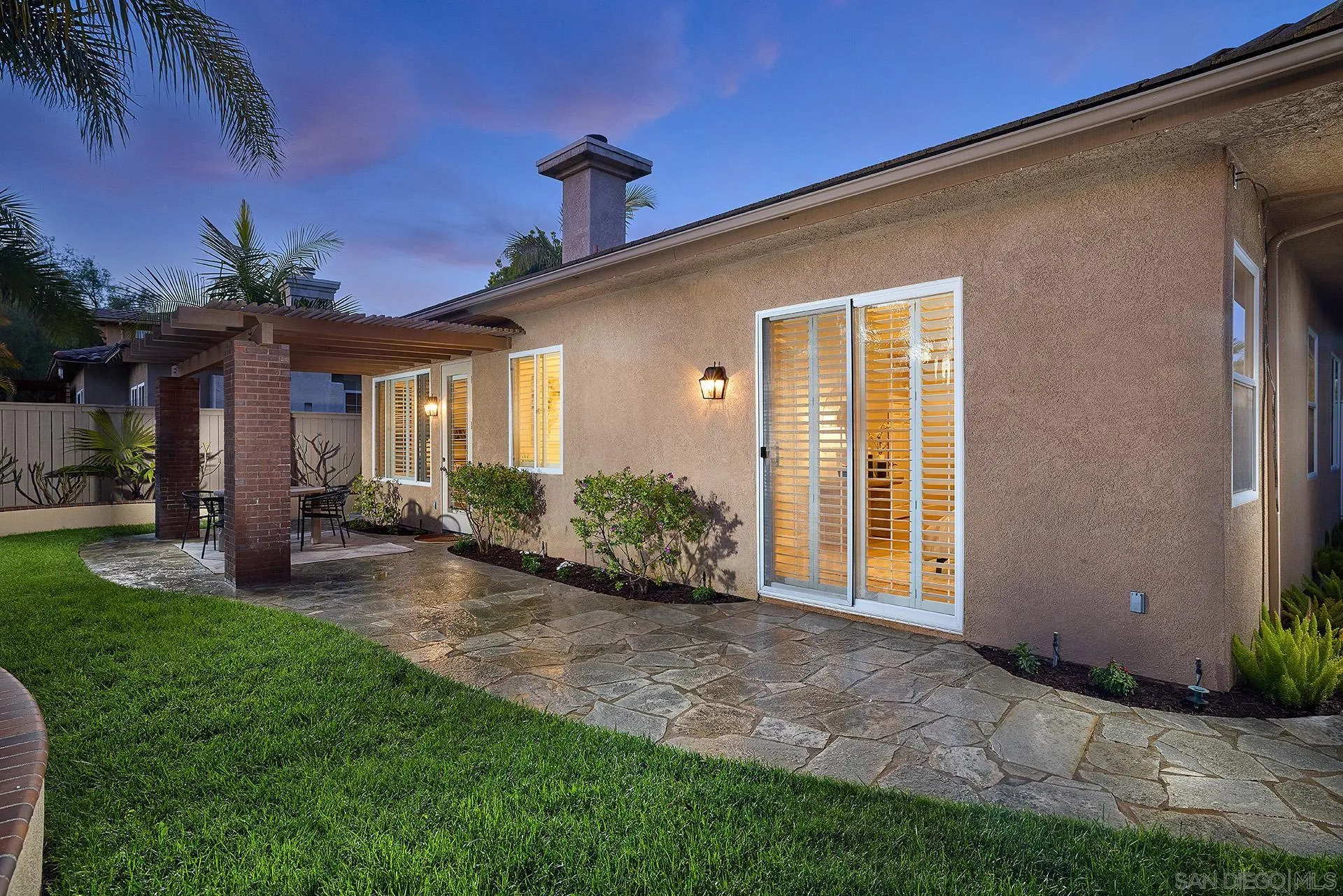 6109 Paseo Tesoro Carlsbad, CA 92009 - Photo 23 of 34 a front view of a house with garden
