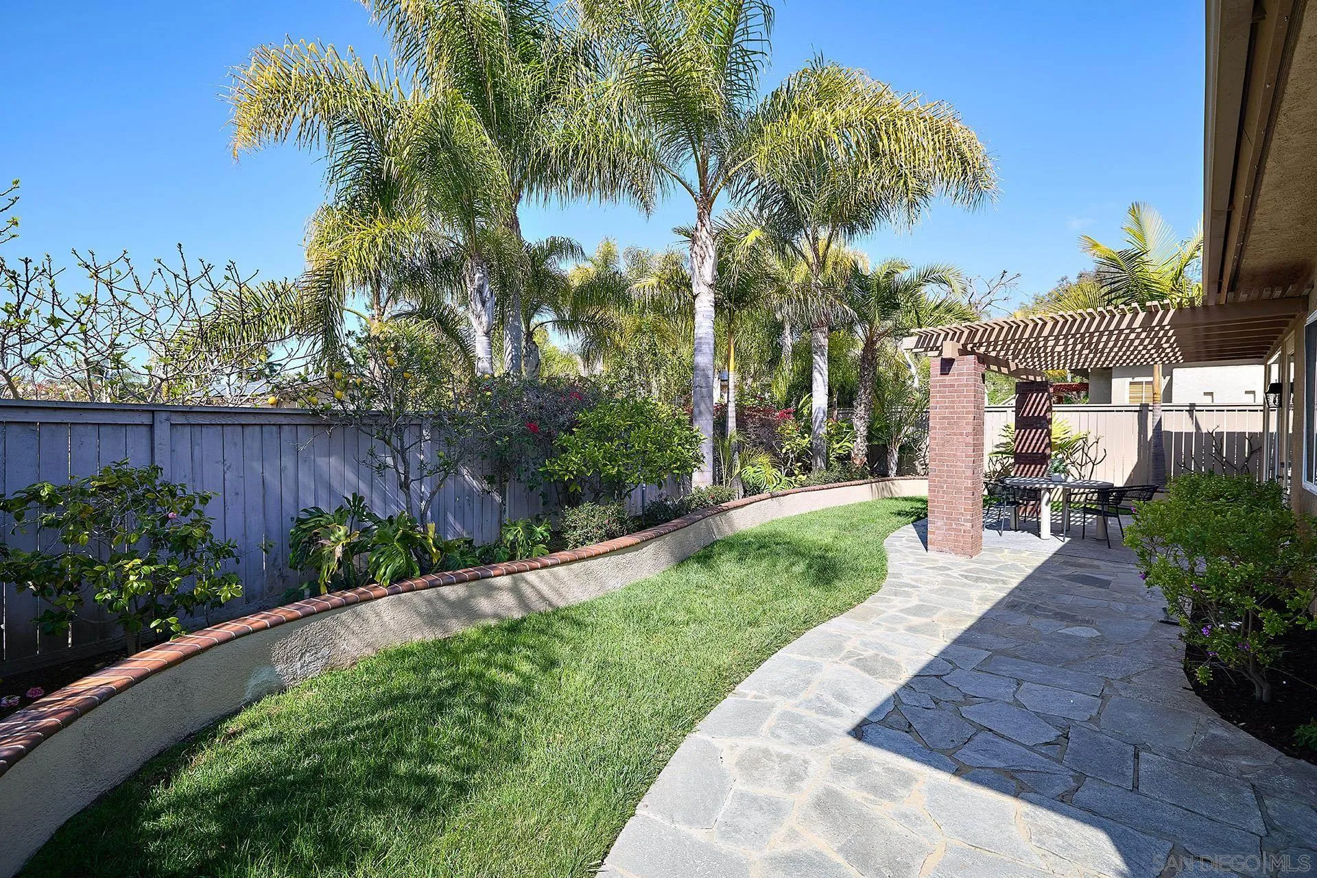 6109 Paseo Tesoro Carlsbad, CA 92009 - Photo 25 of 34 a view of a backyard with a garden