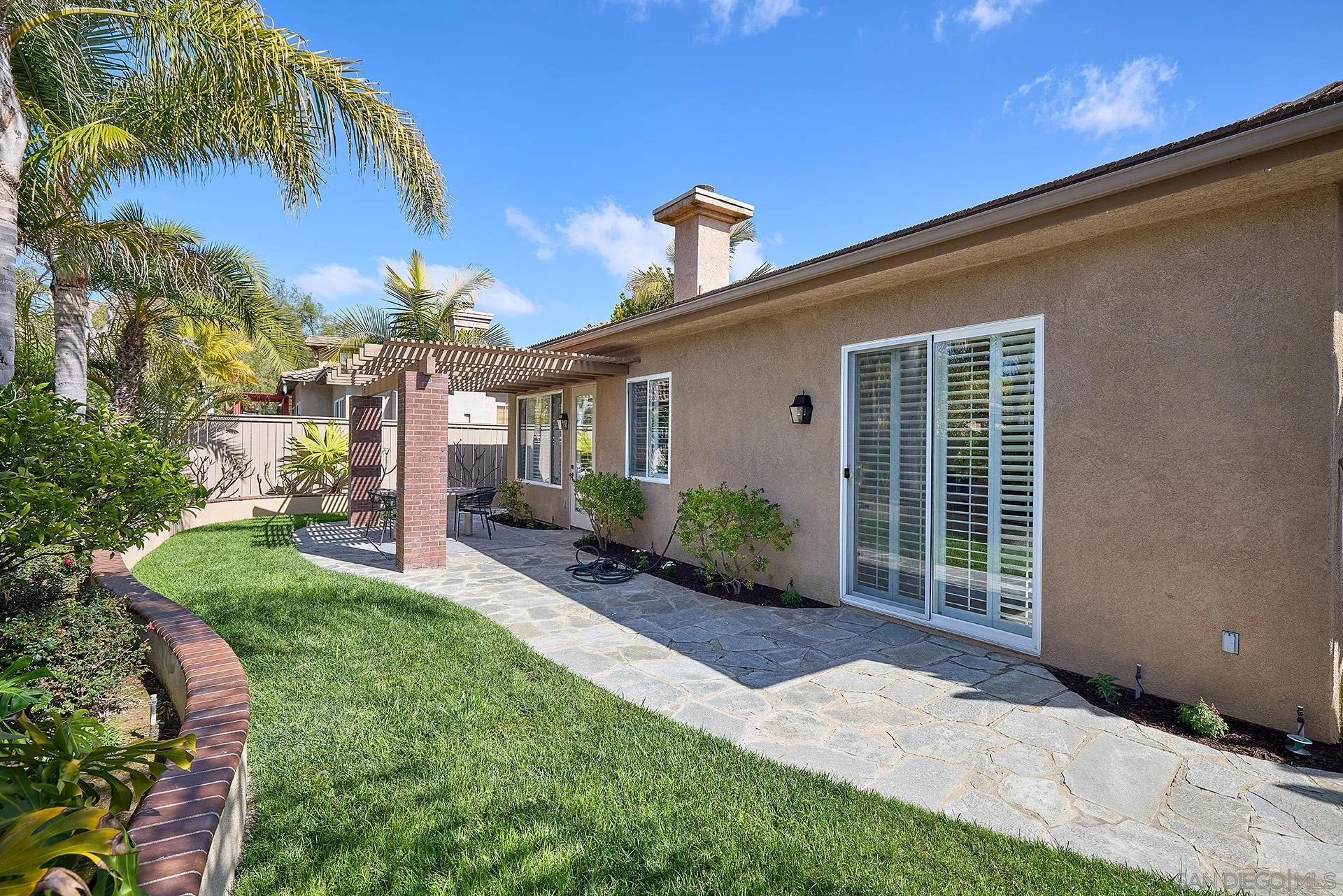 6109 Paseo Tesoro Carlsbad, CA 92009 - Photo 26 of 34 a front view of a house with a yard