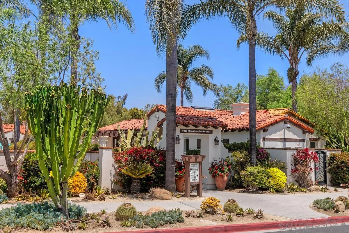 6109 Paseo Tesoro Carlsbad, CA 92009 - Photo 29 of 34 a front view of a house with a yard and a garage