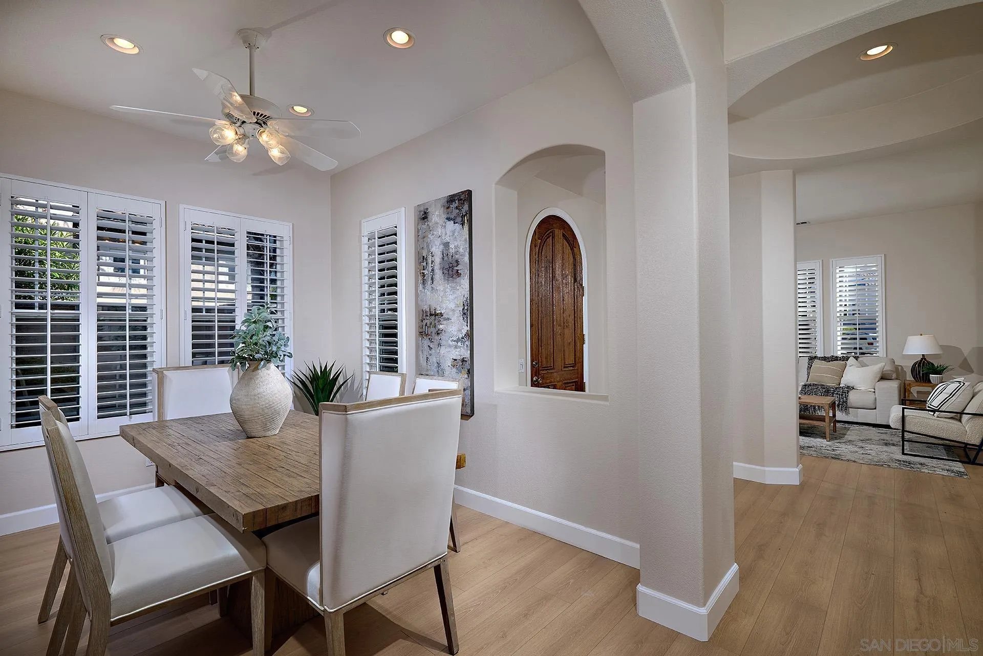 6109 Paseo Tesoro Carlsbad, CA 92009 - Photo 7 of 34 a view of a dining room with furniture and wooden floor