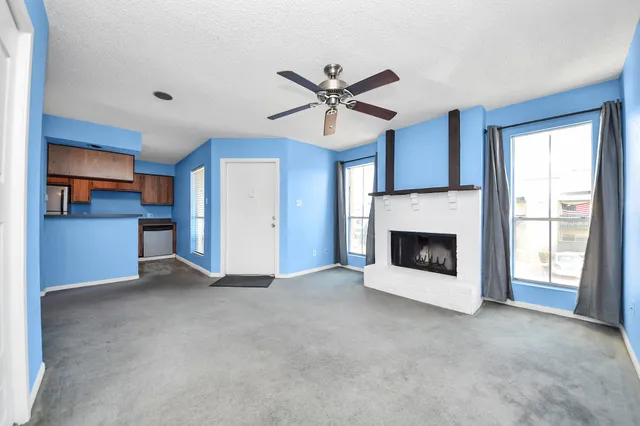 a kitchen with stainless steel appliances granite countertop a refrigerator stove and sink