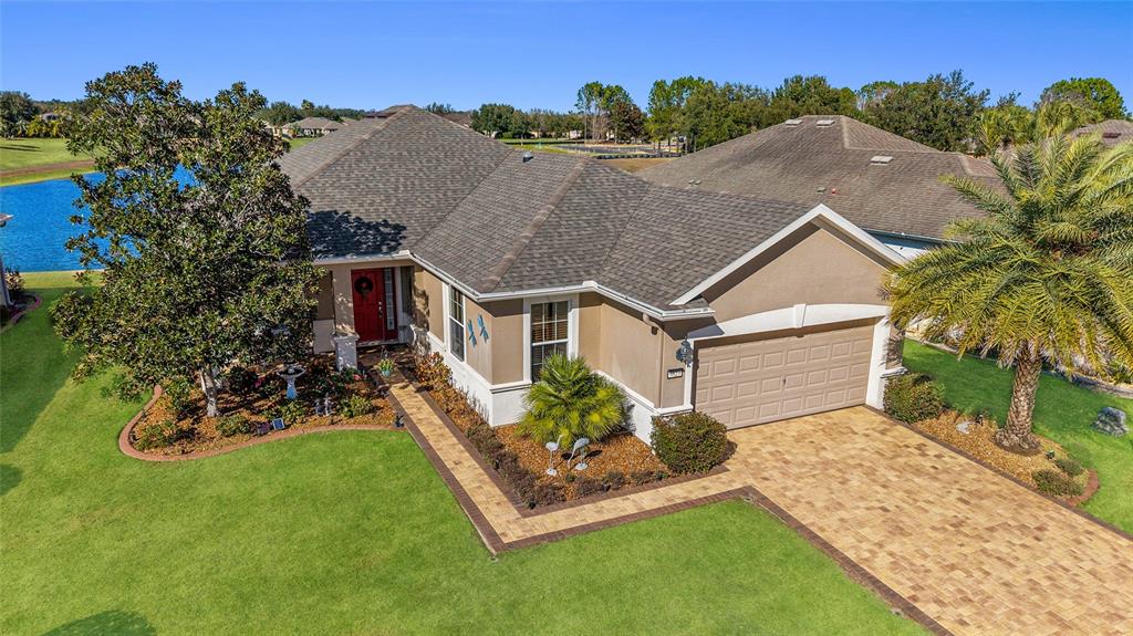 a front view of house with a garden