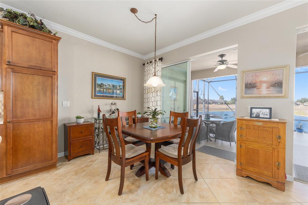 9823 Southwest 72nd Lane Ocala, FL 34481 - Photo 11 of 46 a view of a dining room with furniture