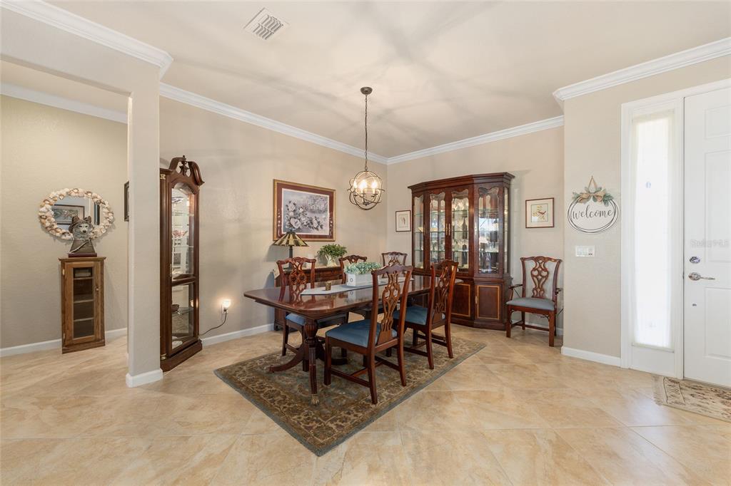 9823 Southwest 72nd Lane Ocala, FL 34481 - Photo 13 of 46 a view of a dining room with furniture