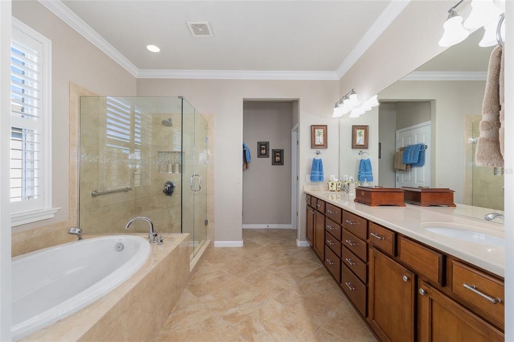 9823 Southwest 72nd Lane Ocala, FL 34481 - Photo 19 of 46 a spacious bathroom with a tub sink shower and mirror