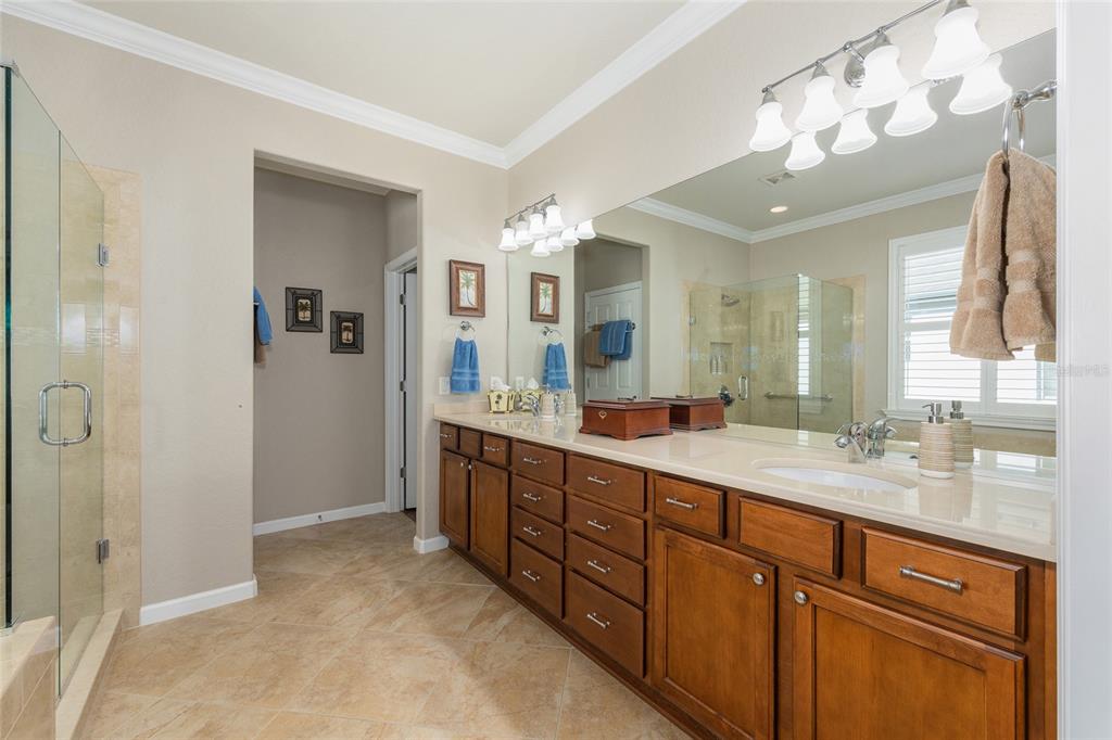 9823 Southwest 72nd Lane Ocala, FL 34481 - Photo 20 of 46 a spacious bathroom with a double vanity sink mirror and double