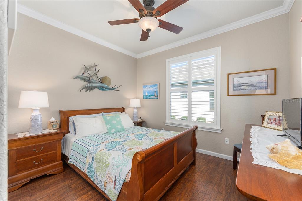 9823 Southwest 72nd Lane Ocala, FL 34481 - Photo 22 of 46 a bed room with a bed and a window