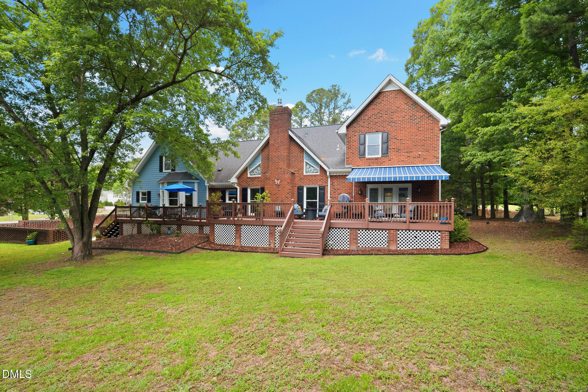 3735 Stoneybrook Drive Durham, NC 27705 - Photo 38 of 44 a front view of a house with a garden and trees