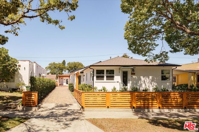 front view of a house with a small yard
