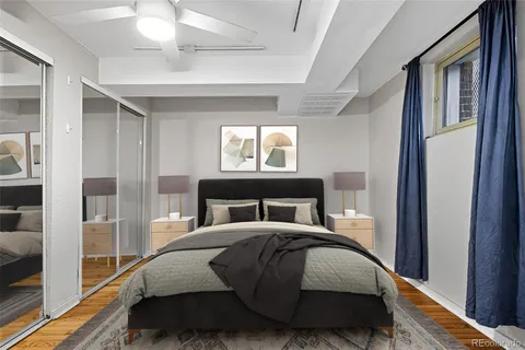 a bedroom with a bed and a mirror