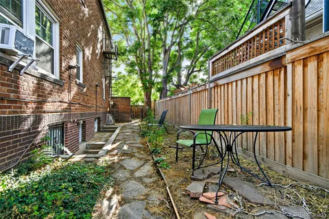a view of a chair and table in the balcony