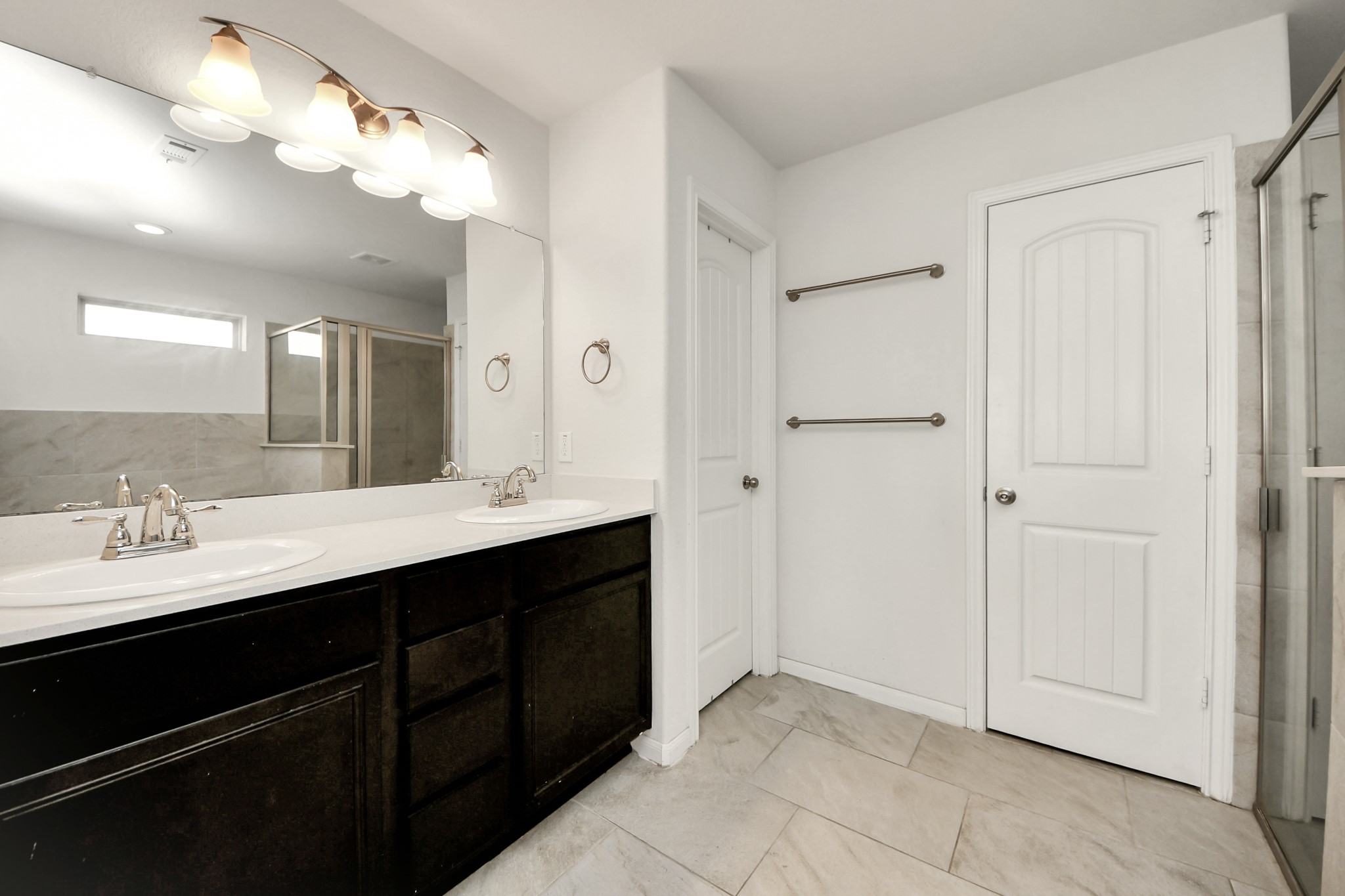 6226 Mason Way Rosenberg, TX 77471 - Photo 15 of 30 a bathroom with a double vanity sink a mirror and a shower