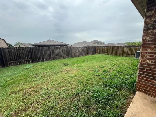 a view of a backyard with pathway