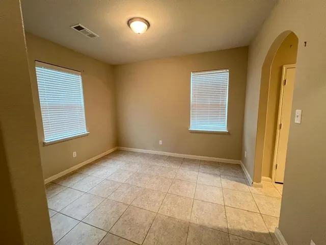 an empty room with windows