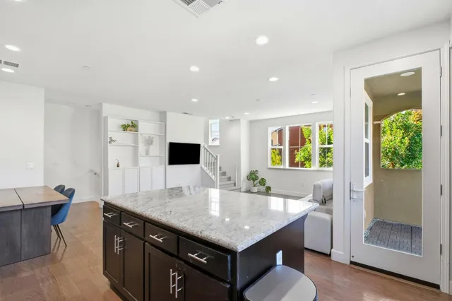 a kitchen with a table and chairs in it