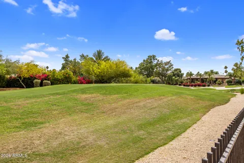 a view of a golf course with a lake