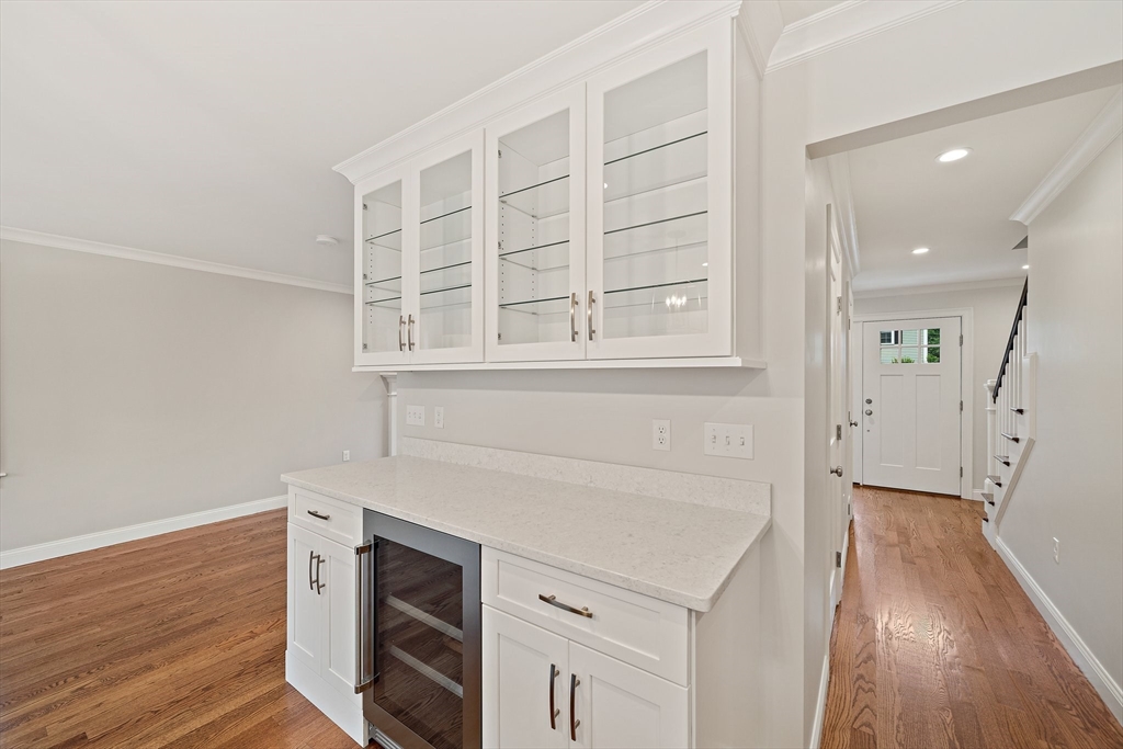 15 Lakeview Avenue Waltham, MA 02451 - Photo 13 of 34 an entryway with wooden floor and cabinets