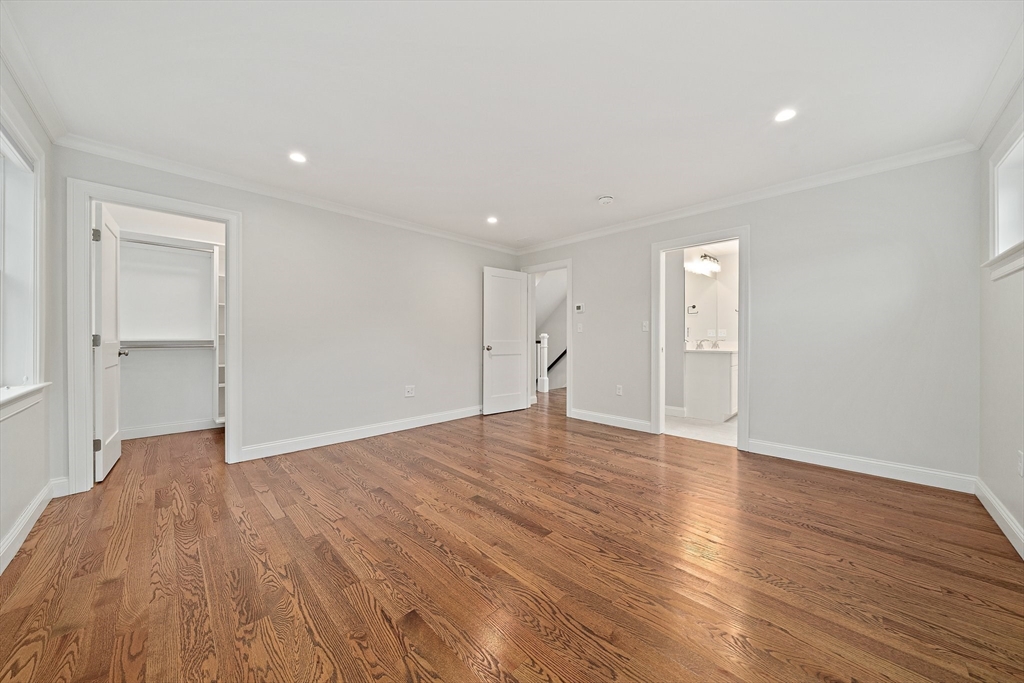 15 Lakeview Avenue Waltham, MA 02451 - Photo 18 of 34 a view of an empty room with wooden floor and closet