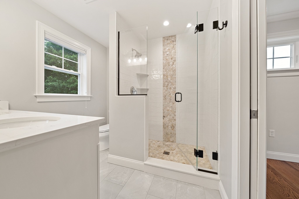 15 Lakeview Avenue Waltham, MA 02451 - Photo 21 of 34 a bathroom with a shower and a sink