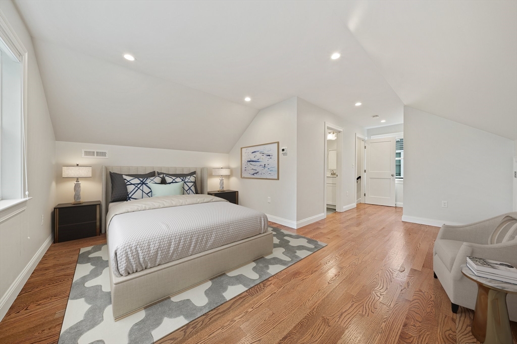 15 Lakeview Avenue Waltham, MA 02451 - Photo 27 of 34 a spacious bedroom with a bed and a couch