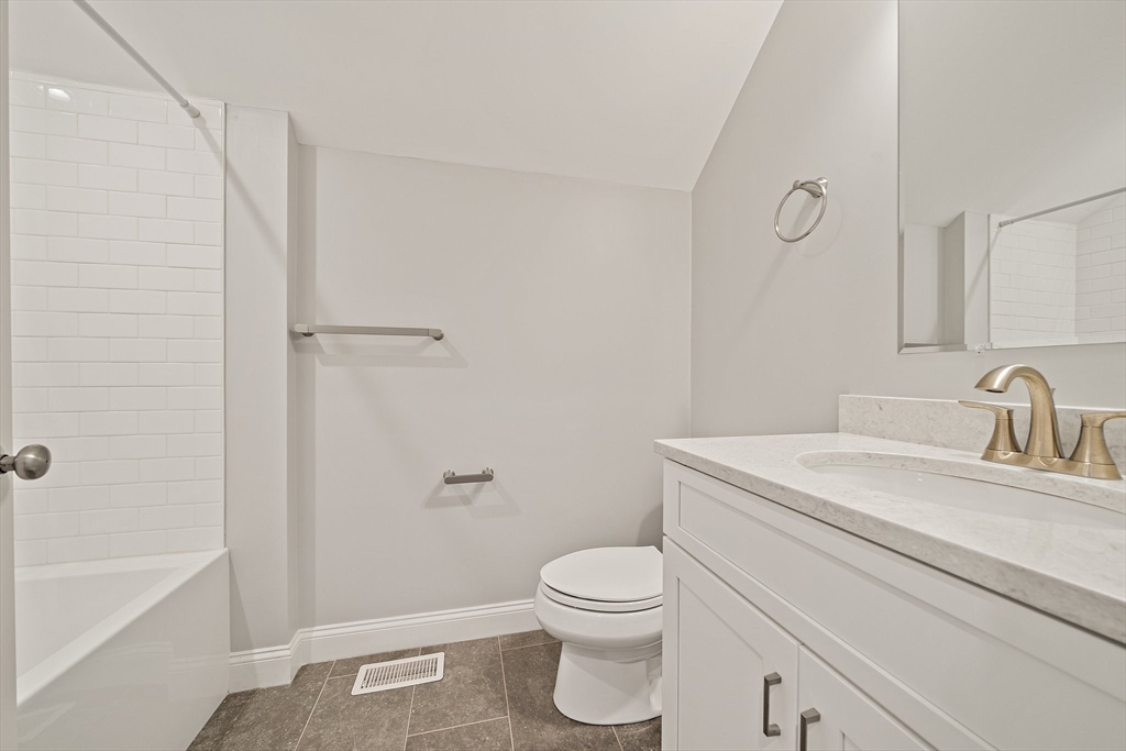 15 Lakeview Avenue Waltham, MA 02451 - Photo 29 of 34 a bathroom with a granite countertop sink toilet and shower