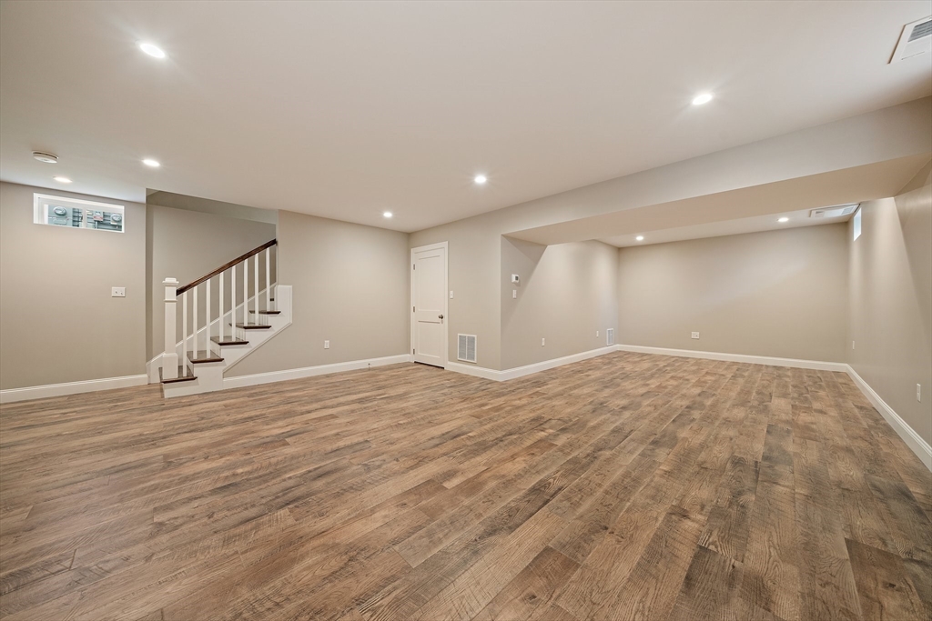 15 Lakeview Avenue Waltham, MA 02451 - Photo 31 of 34 a view of an empty room with wooden floor