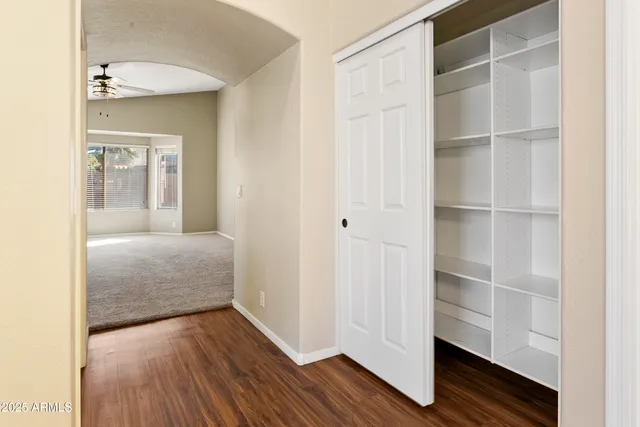 a view of bedroom with wooden floor
