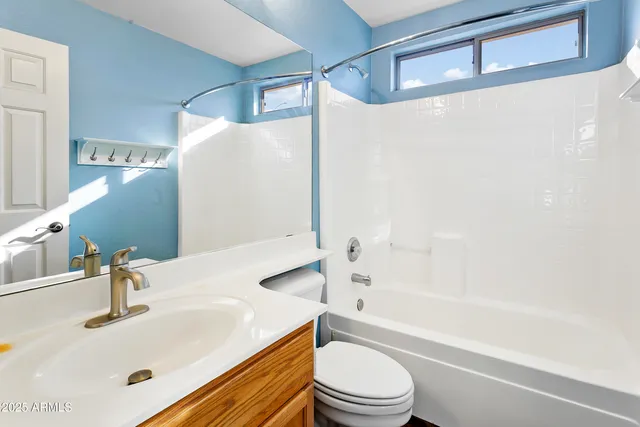 a bathroom with a sink a toilet and a bathtub