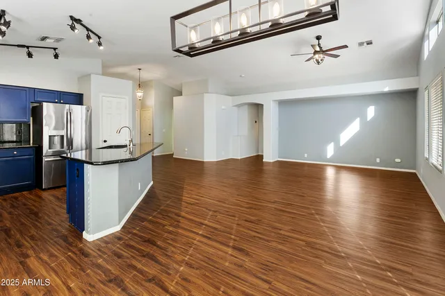 a view of a room with wooden floor